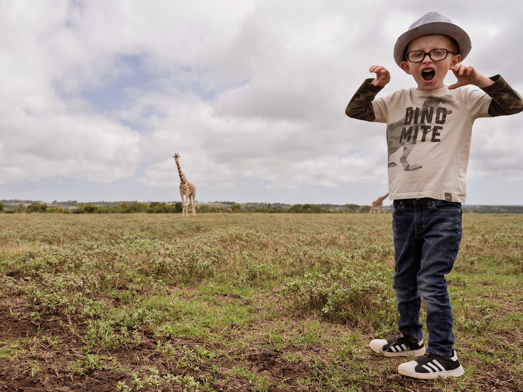 Vincent with giraffe in Kenya